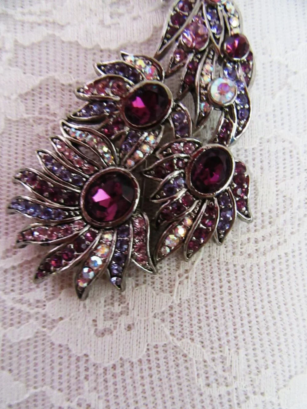 Peacock brooch with purple and aurora borealis rhinestones in silver setting